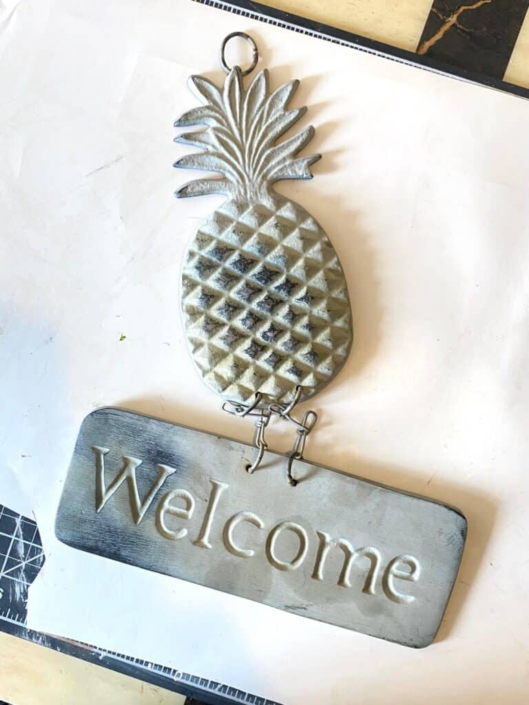 Metal boring thrift store find- Pineapple welcome sign, before it was painted.