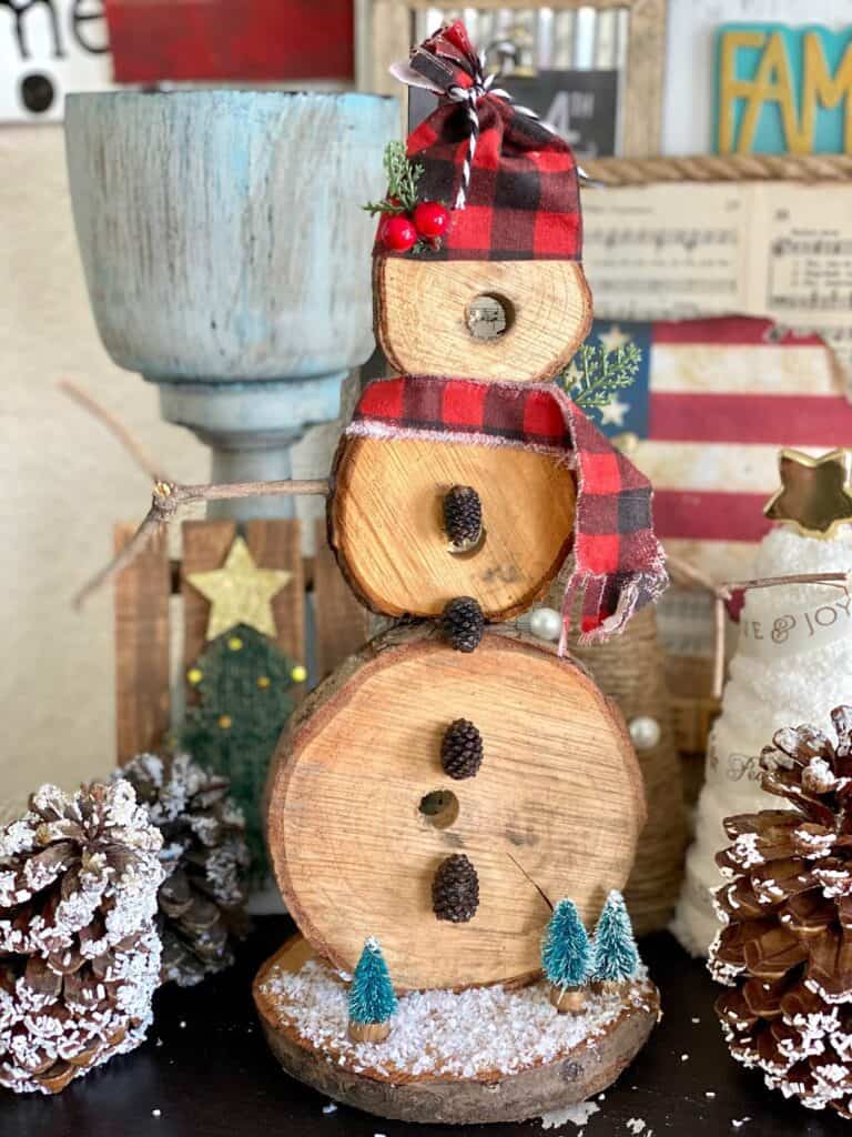 DIY Rustic wooden snowman handmade Christmas crafts and decorations for a rustic farmhouse style.