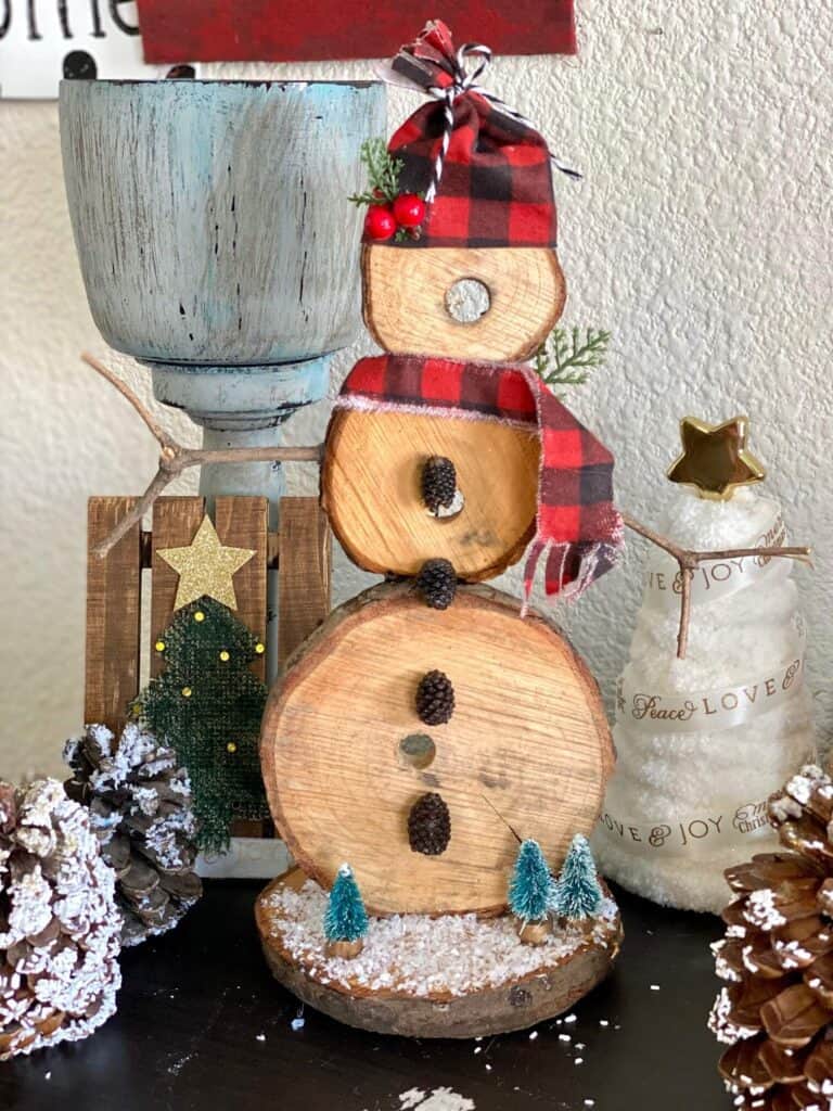 DIY Rustic wooden snowman handmade Christmas crafts and decorations for a rustic farmhouse style.