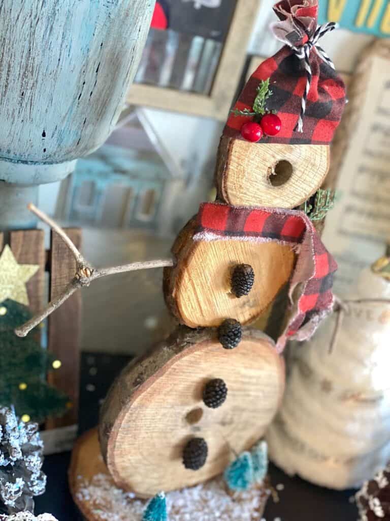 DIY Rustic wooden snowman handmade Christmas crafts and decorations for a rustic farmhouse style.