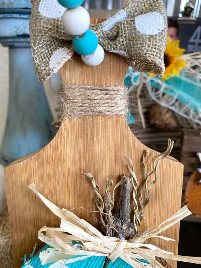 Decorative twine wrapped around the handle of the mini wooden cutting board.