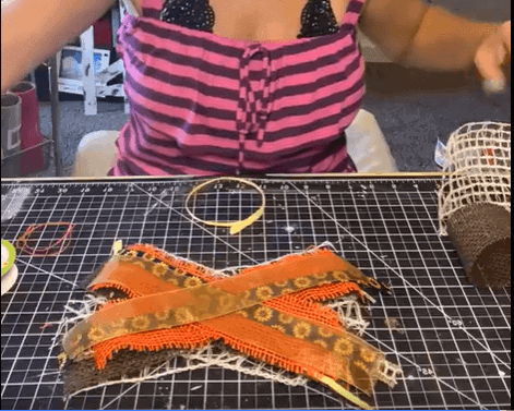 Make a big messy bow by using coordinating fall colors and criss crossing them in an X formation.