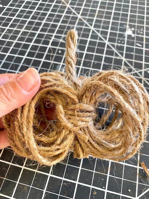 Wrap a piece of twine around the center to cover the floral wire.