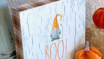 Rae Dunn Boo Gnome napkin Halloween shelf sitter with napkin decoupage and crackle paint method combined, next to a little pumpkin.