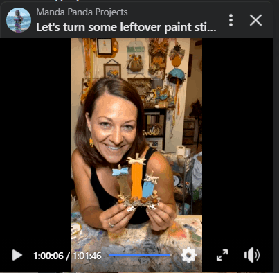 Amanda holding the completed mini craft project on a Facebook Live screenshot.