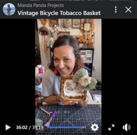 Amanda holding the completed project on a Facebook live screenshot.