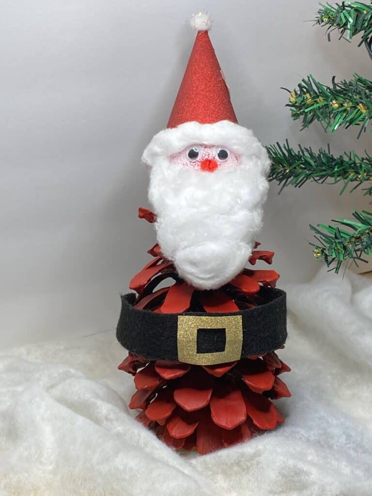 Pine Cone Santa Claus Kids Christmas Craft made with nature supplies.