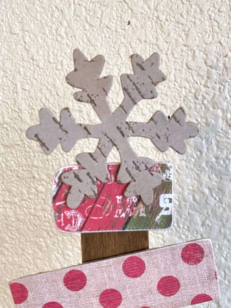 Cardboard snowflake Christmas tree topper.