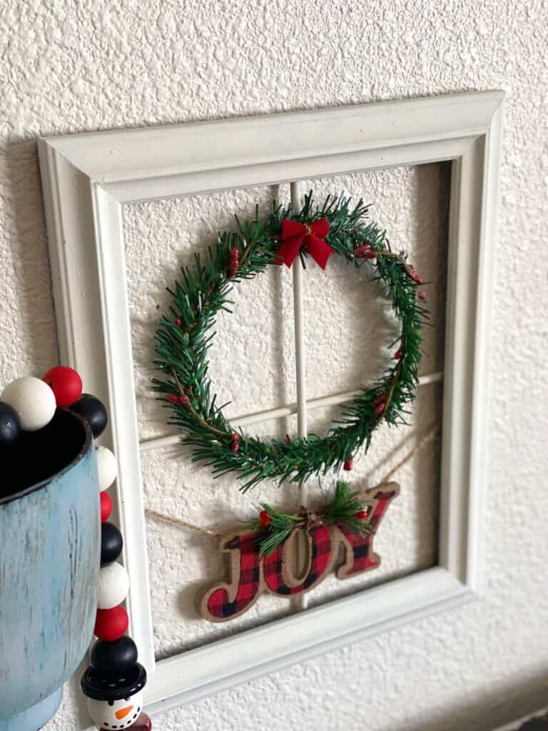 Christmas Wreath Window Frame decor, big lots copycat diy with Dollar Tree supplies and a "joy" christmas ornament instead of trees