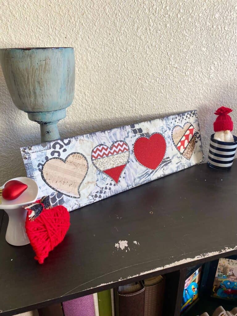 Mixed Media DIY Valentines Day Decor with funky red, leopard, and glitter hearts. Craft idea to create and decorate for February 4th. #valentinesdayideas #mixedmedia