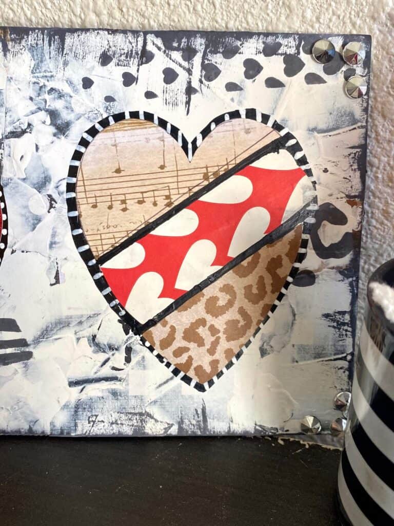 Mixed Media heart with music sheet paper, red and white heart paper, and leopard print paper.