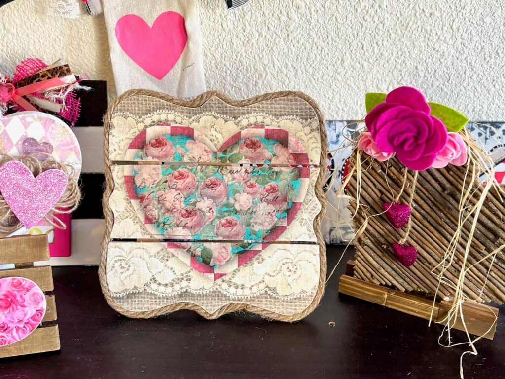 DIY Valentines Vintage Printable Heart Decor with roses, burlap, and lace on a wood Pallet Board to make DIY Valentine's Day Decor.