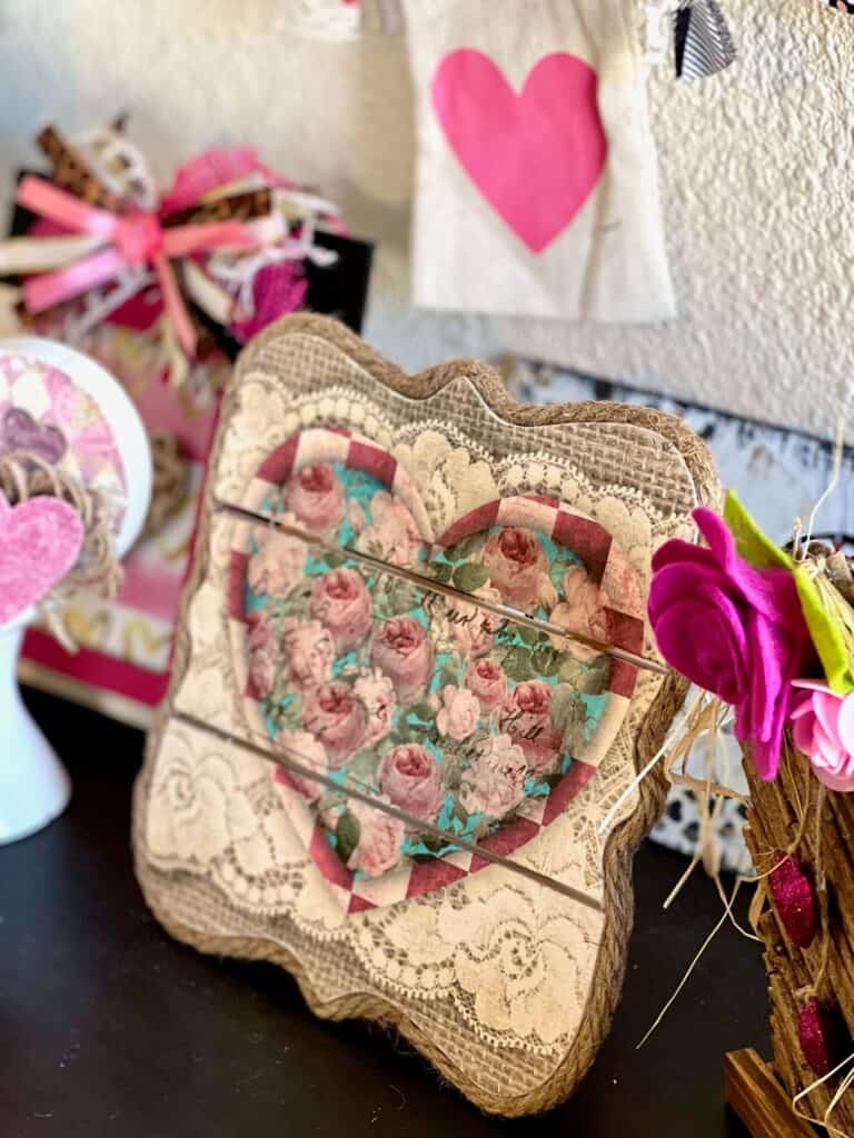 DIY Valentines Vintage Printable Heart Decor with roses, burlap, and lace on a wood Pallet Board to make DIY Valentine's Day Decor.