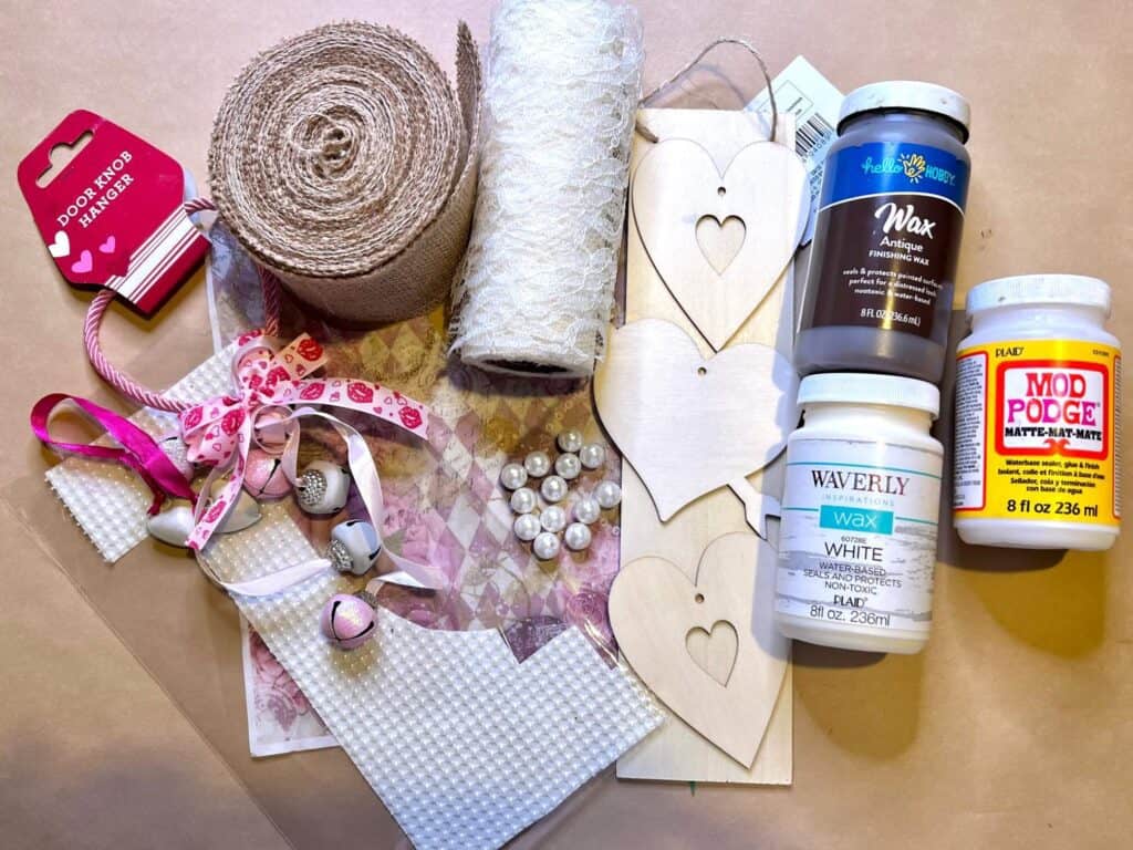 Supplies needed to make a vintage heart DIY door hanger.