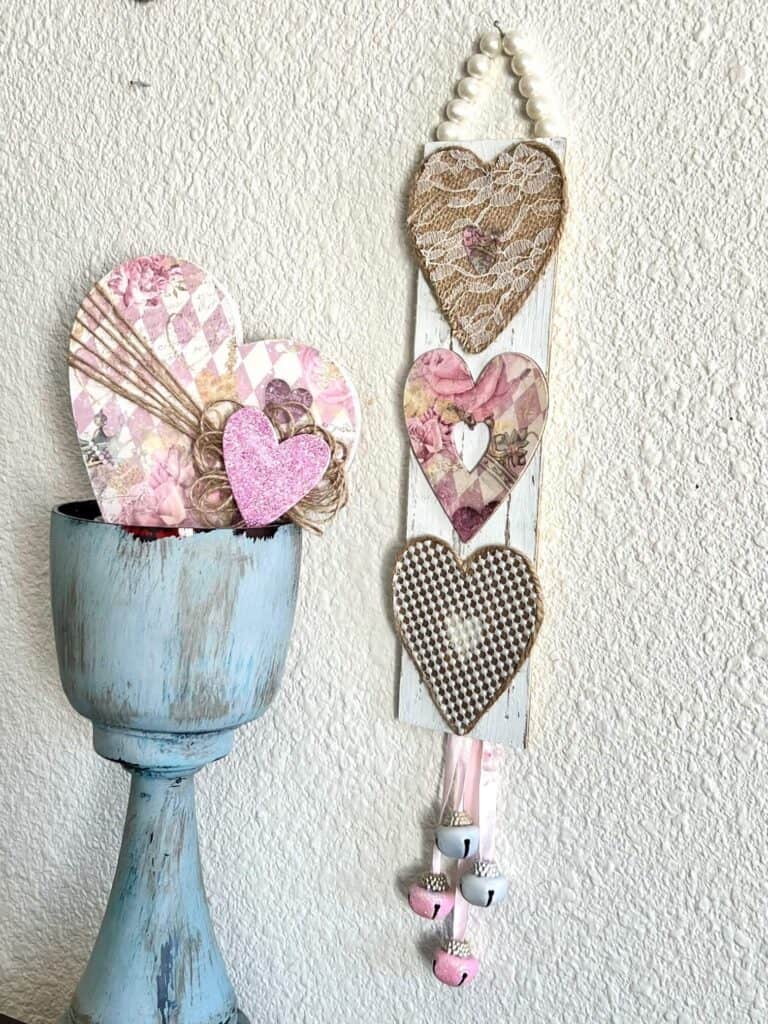 Vintage Burlap, lace, and pearl valentines day hearts DIY door hanger decor next to a chunky candlestick and a sideways heart.