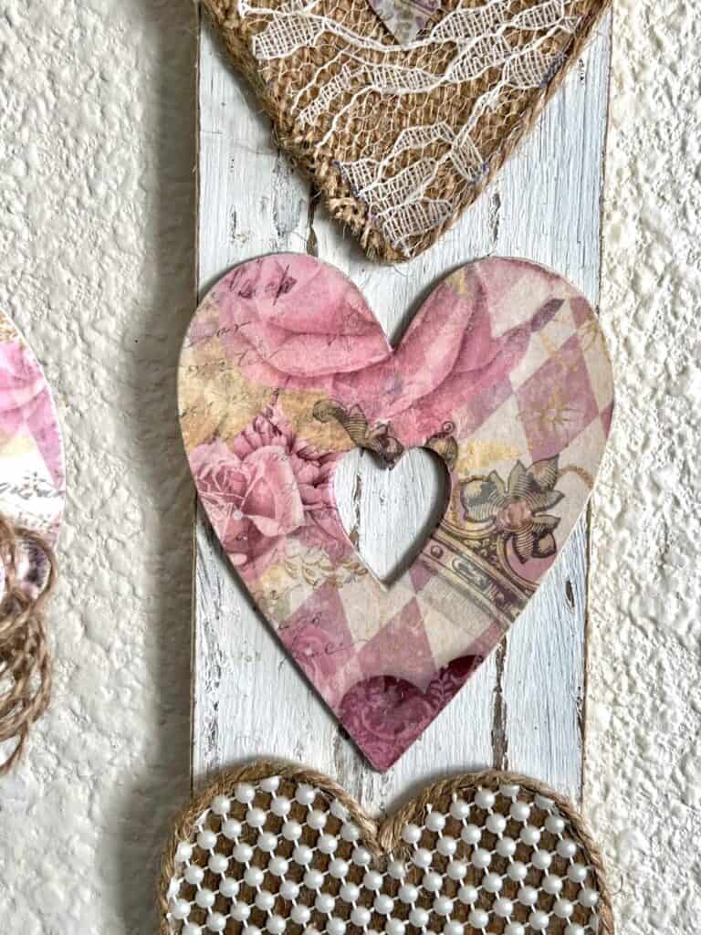 Vintage printable craft paper decoupaged onto a heart.