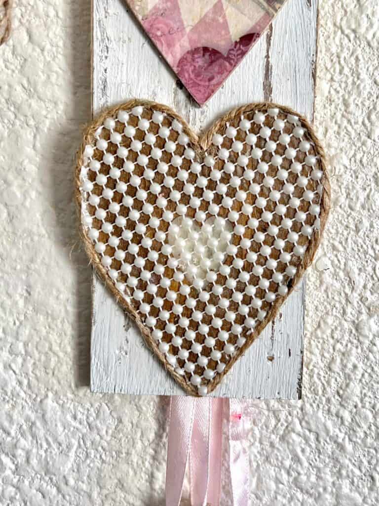 Heart covered with mini pearl strip adhesive.