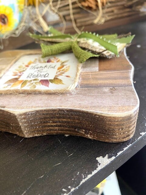 Mod Podge the faux wood scrapbook paper to the wooden block and sand the edges to give it a finished look.