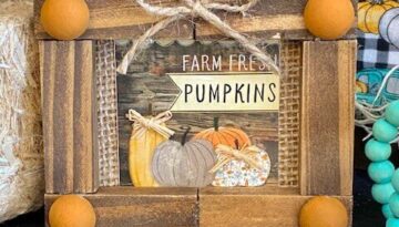 Dollar Tree Mini Calendar Frame with the Farm Fresh Pumpkins print from the back made with jenga blocks as the frame.