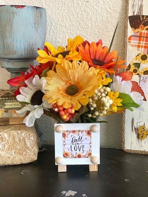 Dollar Tree "fall in love" back of the calendar mini print with a mixed sunflower bouquet.