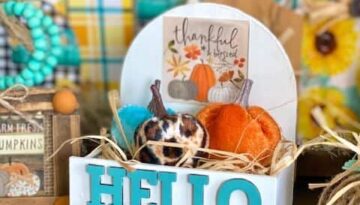 Dollar Tree Hello Autumn mini tiered tray pumpkin crate with the Dollar Tree "Thankful and Blessed" print from the back of the calendar with an orange, teal, and leopard print pumpkin.