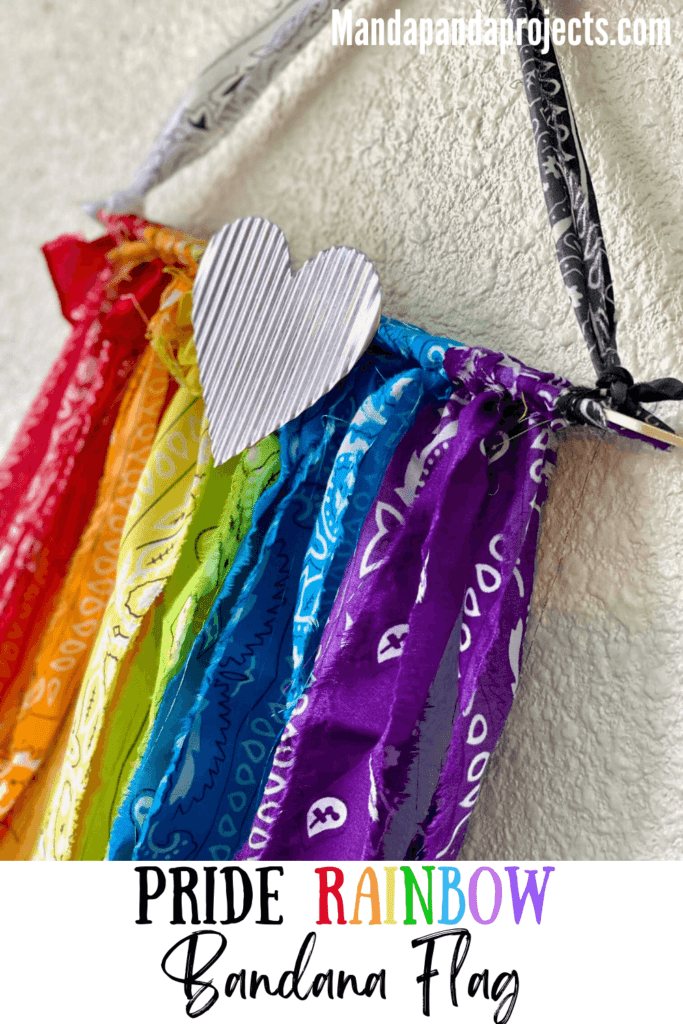 DIY Rainbow Bandana Handkerchief flag for celebrating Pride month in June with a small metal heart., or for kids classroom or playroom decor.