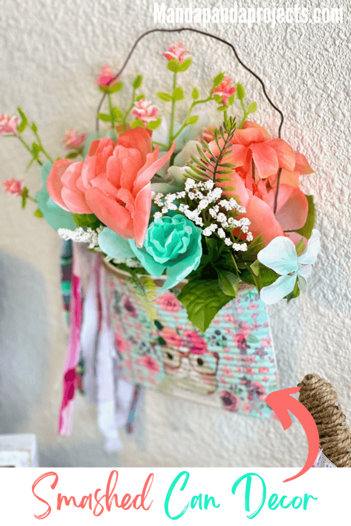 Spring and Easter Bunny upcycled Crushed can decor craft project with a napkin and flowers and rusty wire hanger and a shabby bow, with a twine trim.