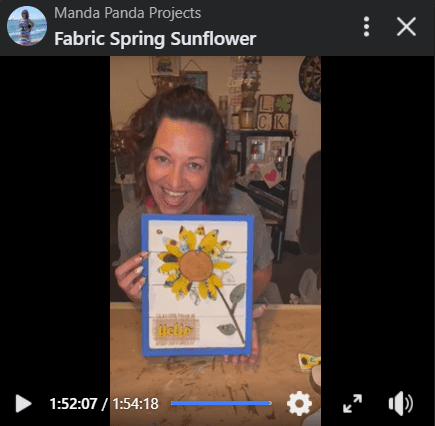 Amanda holding the completed fabric sunflower project on a Facebook Live thumbnail.