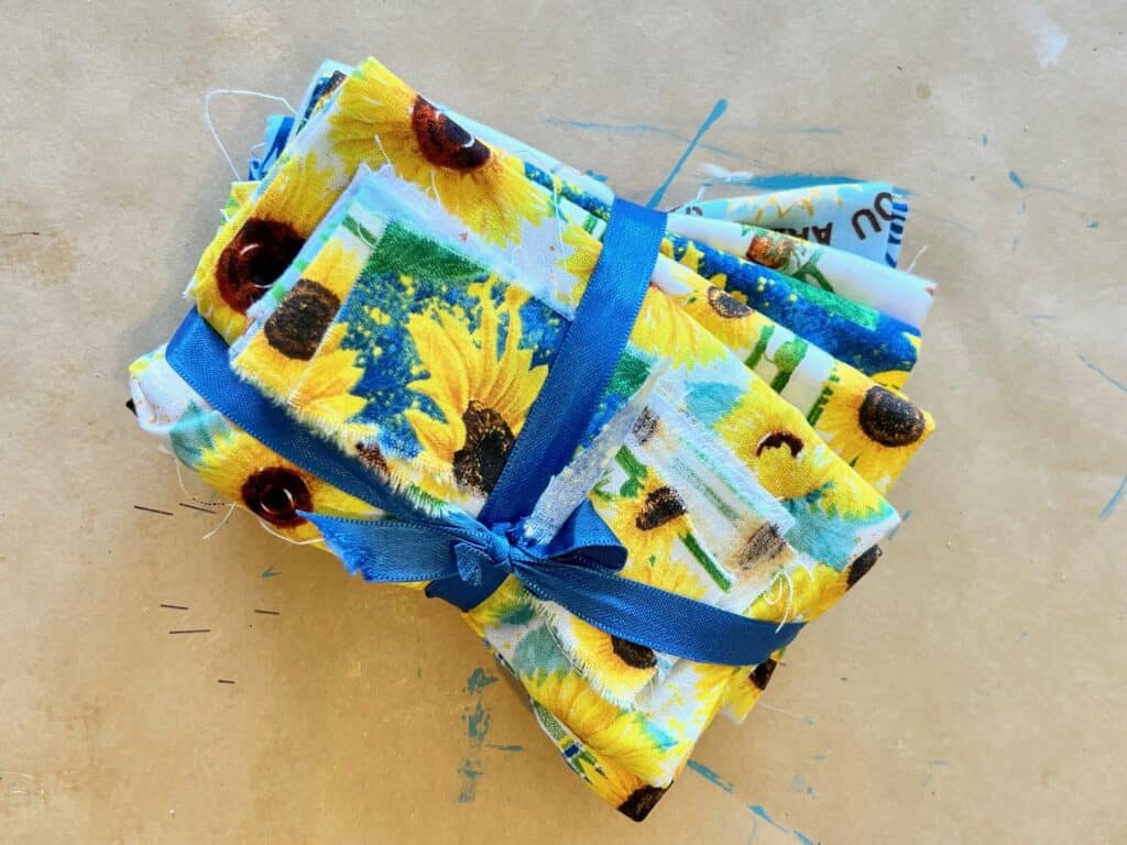 Blue and yellow sunflower fabric bundle.