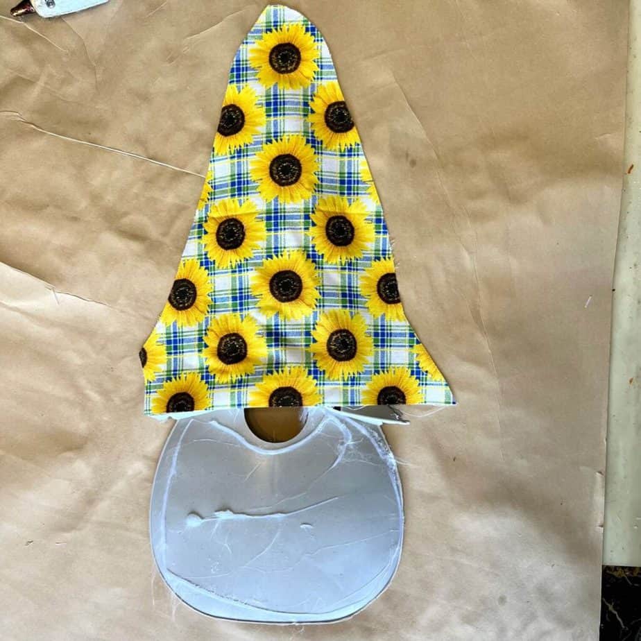 Plastic gnome frame with the sunflower fabric on top of the hat.
