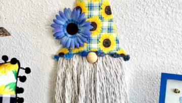 DIY Dollar Tree Easter Gnome makeover into a Sunflower Gnome with Blue and yellow sunflower summer fabric and a mop head as the beard..