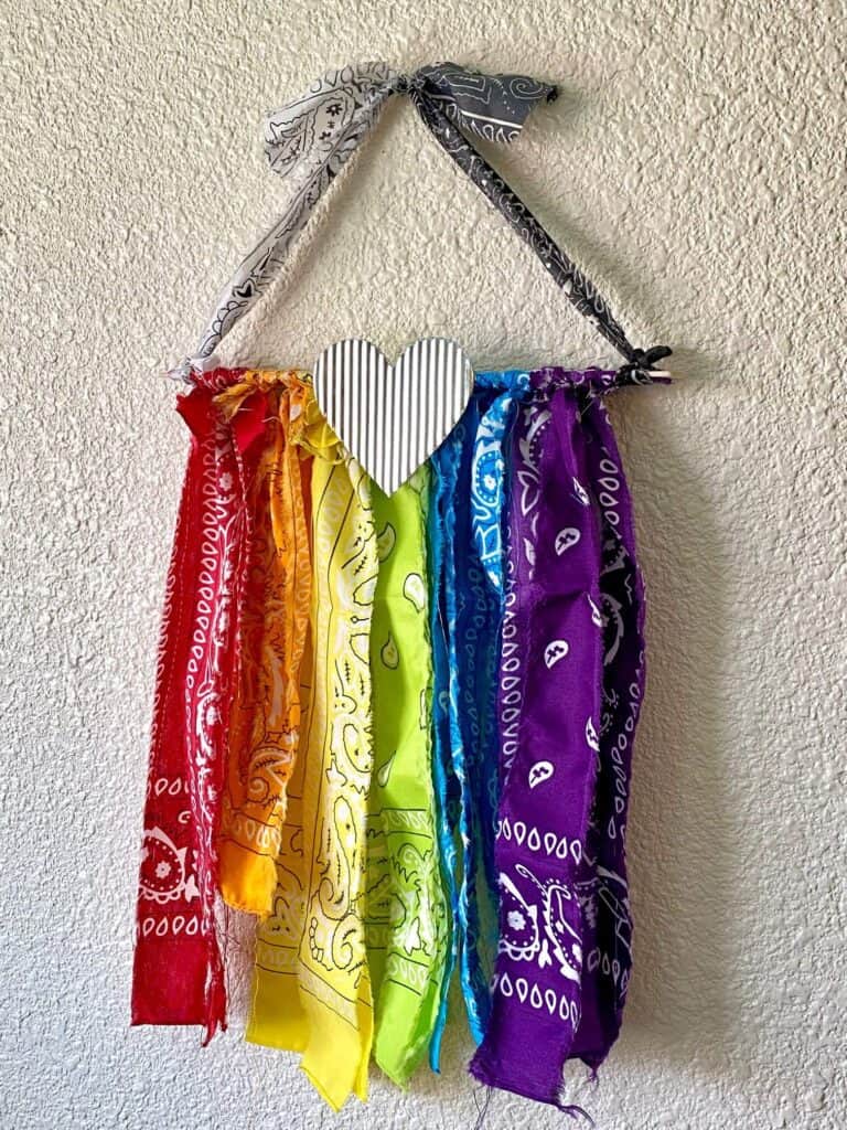 DIY Rainbow Bandana Handkerchief flag for Pride month in June with a small metal heart.
