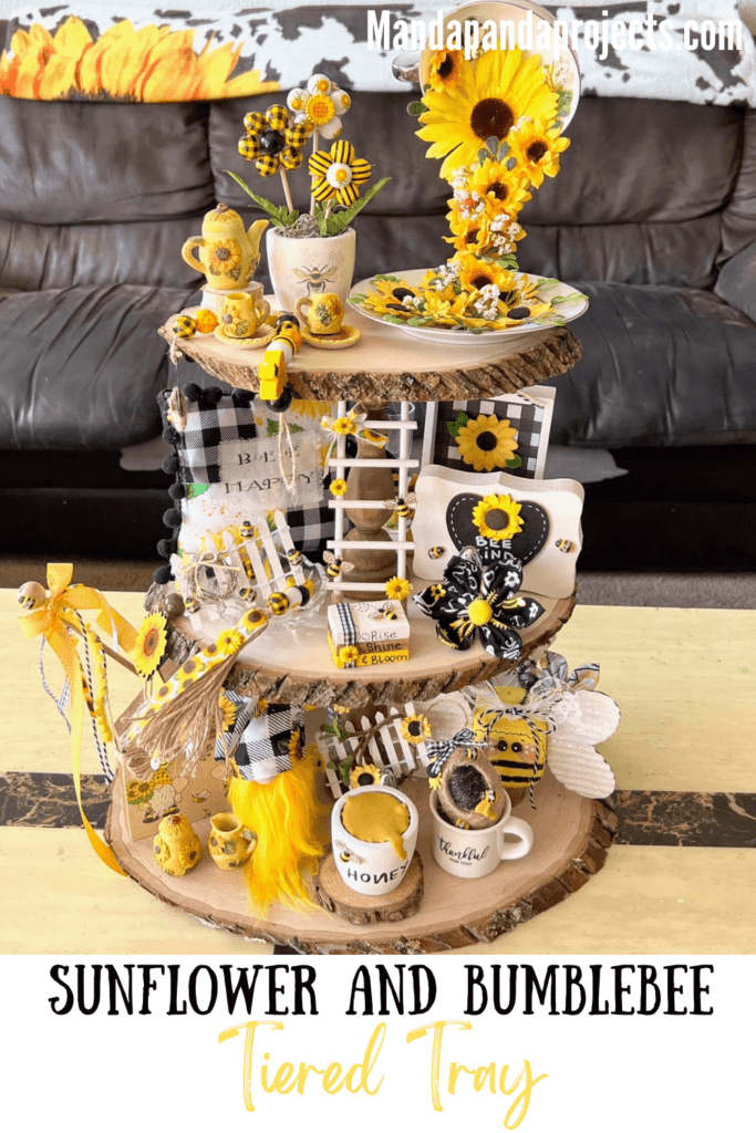 Rustic Handmade Summer Sunflower and Bumblebee themed 3 tiered tray decorated and styled with tons of handmade crafts and decor that are yellow, black, and white.