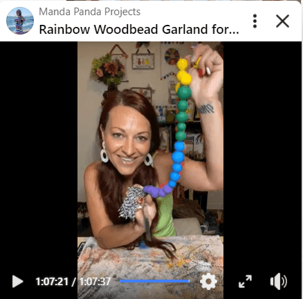 Amanda holding the completed project on a Facebook live thumbnail
