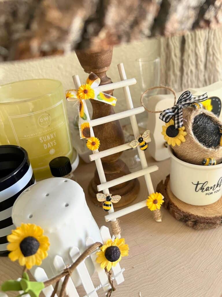 Sunflower and Bee mini Tiered tray decor ladder with a small sunflower bow on the top, mini sunflowers, and rhinestone bees.