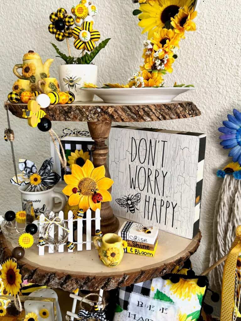 Don't worry bee happy crackle paint shelf sitter on the middle tier of the tray.