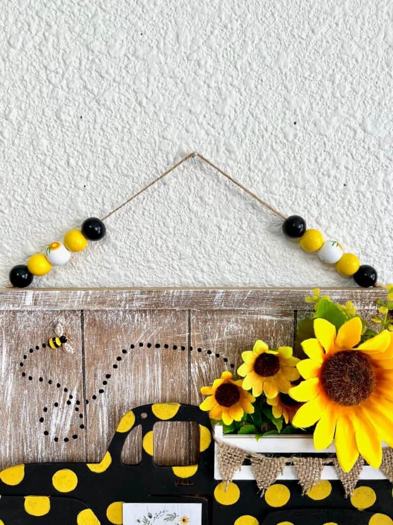 Make a half wood bead hanger to hang the truck up.