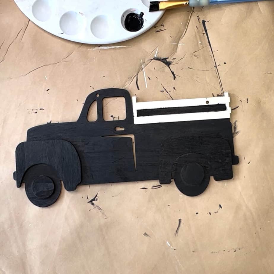 Paint the entire wooden truck black.