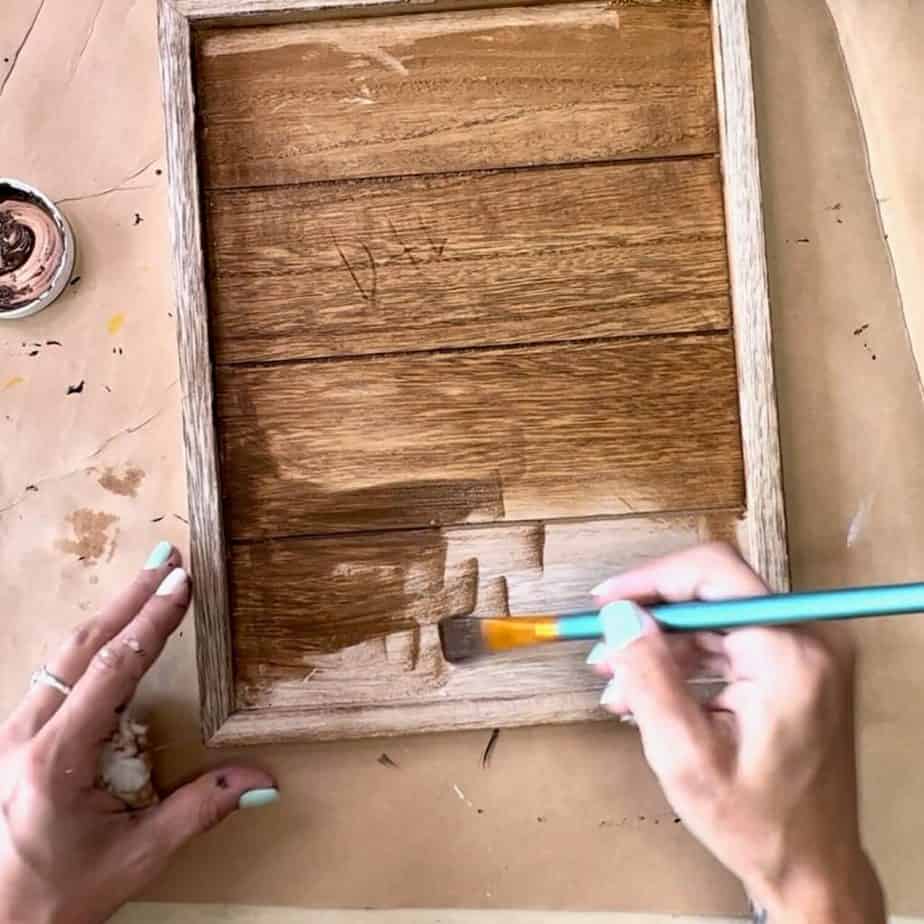 Cover the the entire wooden frame with the Antique Wax and then wipe down with a paper towel.