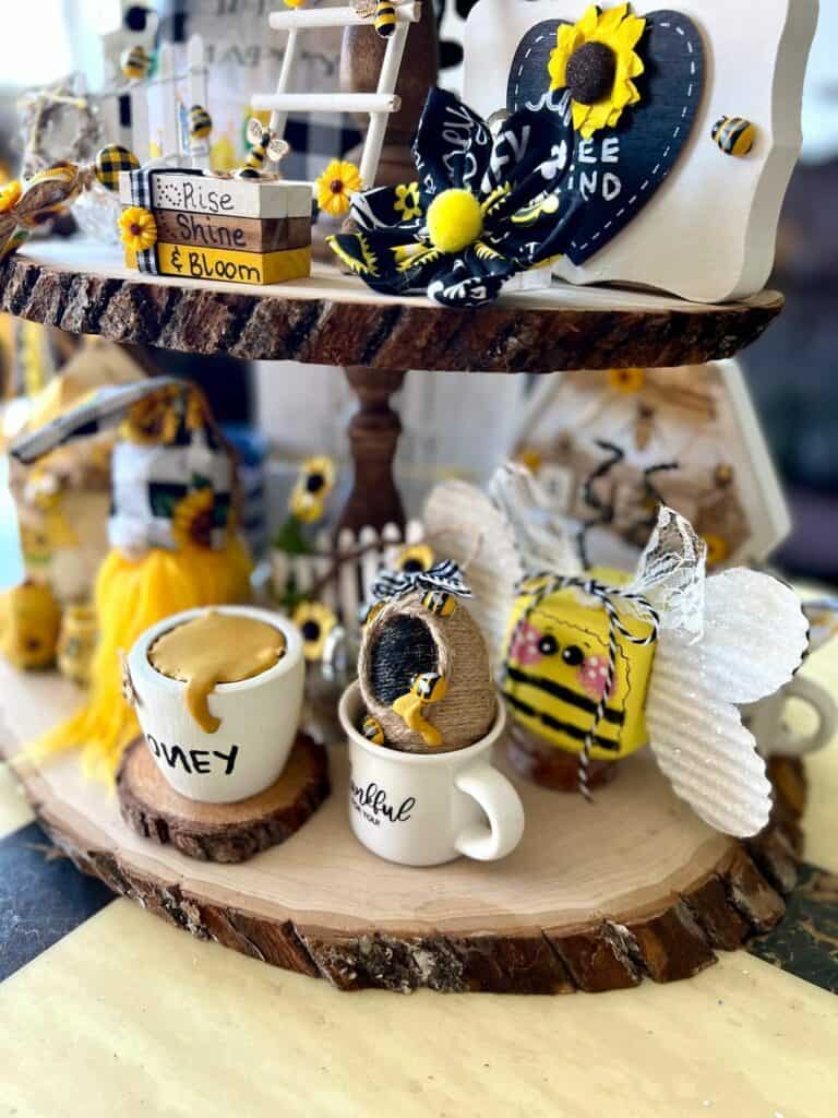 View from the right side of the bottom tier of the tray showing the mini bee hive and the foam dice bumble bee.