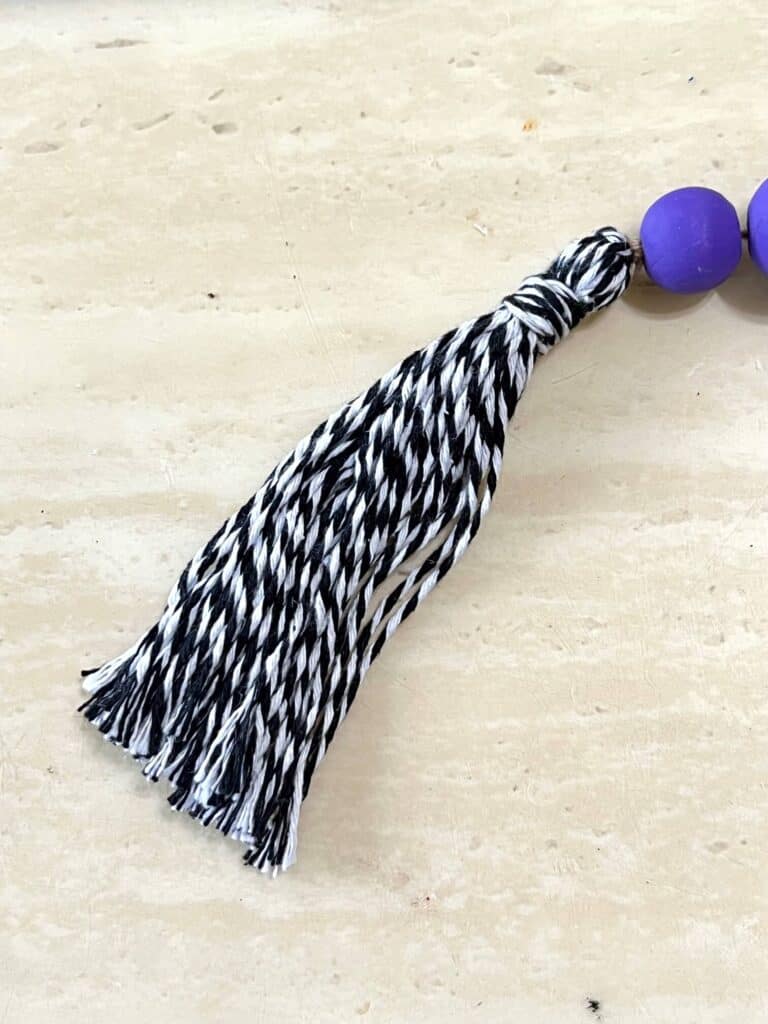 Handmade Tassel with black and white bakers twine.