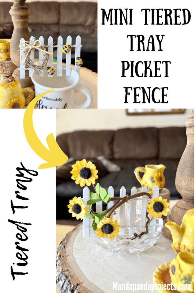 Sunflower and bee Tiered Tray Mini Picket Fence. 2 little white fences, one with a sunflower vine and one with a mini wreath and bumblebees, sitting on a wooden tray.