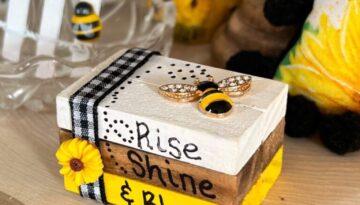 Mini Dollar Tree Jenga Block Bookstack in the sunflower bee theme with the words "rise, shine, & bloom" for tiered tray decor for a sunflower theme tier tray