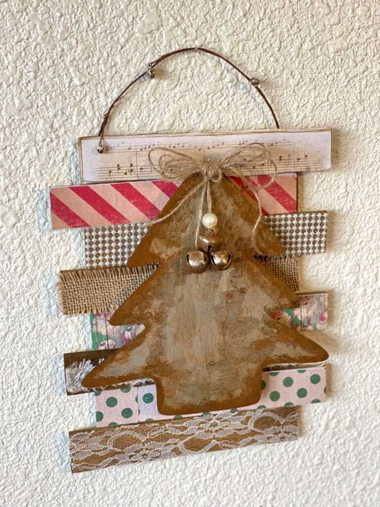 Faux rusted galvanized metal dollar tree vintage christmas tree diy decor made with wooden shims, burlap, lace, pearls, music sheet, rusted with the cinnamon technique for a vintage style.