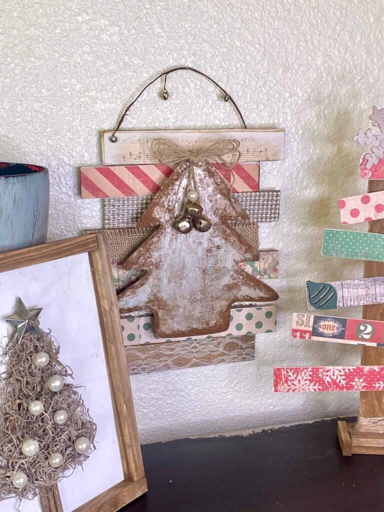 Faux rusted galvanized metal dollar tree vintage christmas tree diy decor made with wooden shims, burlap, lace, pearls, music sheet, rusted with the cinnamon technique for a vintage style.