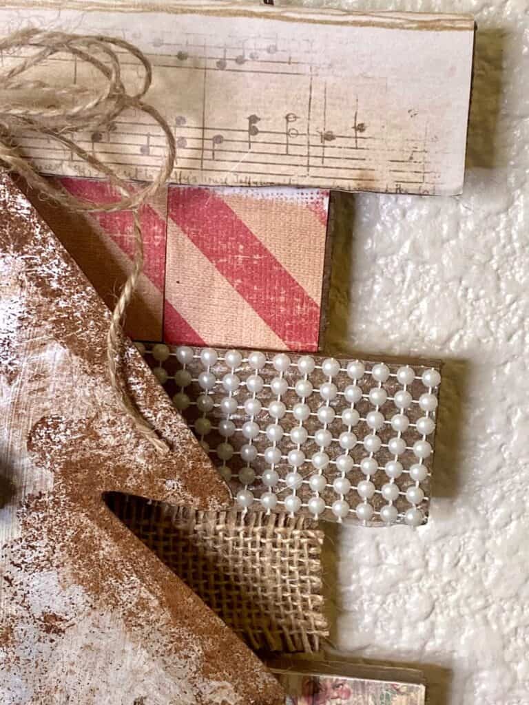 Close up of the faux rusted galvanized metal and the burlap with pearls.