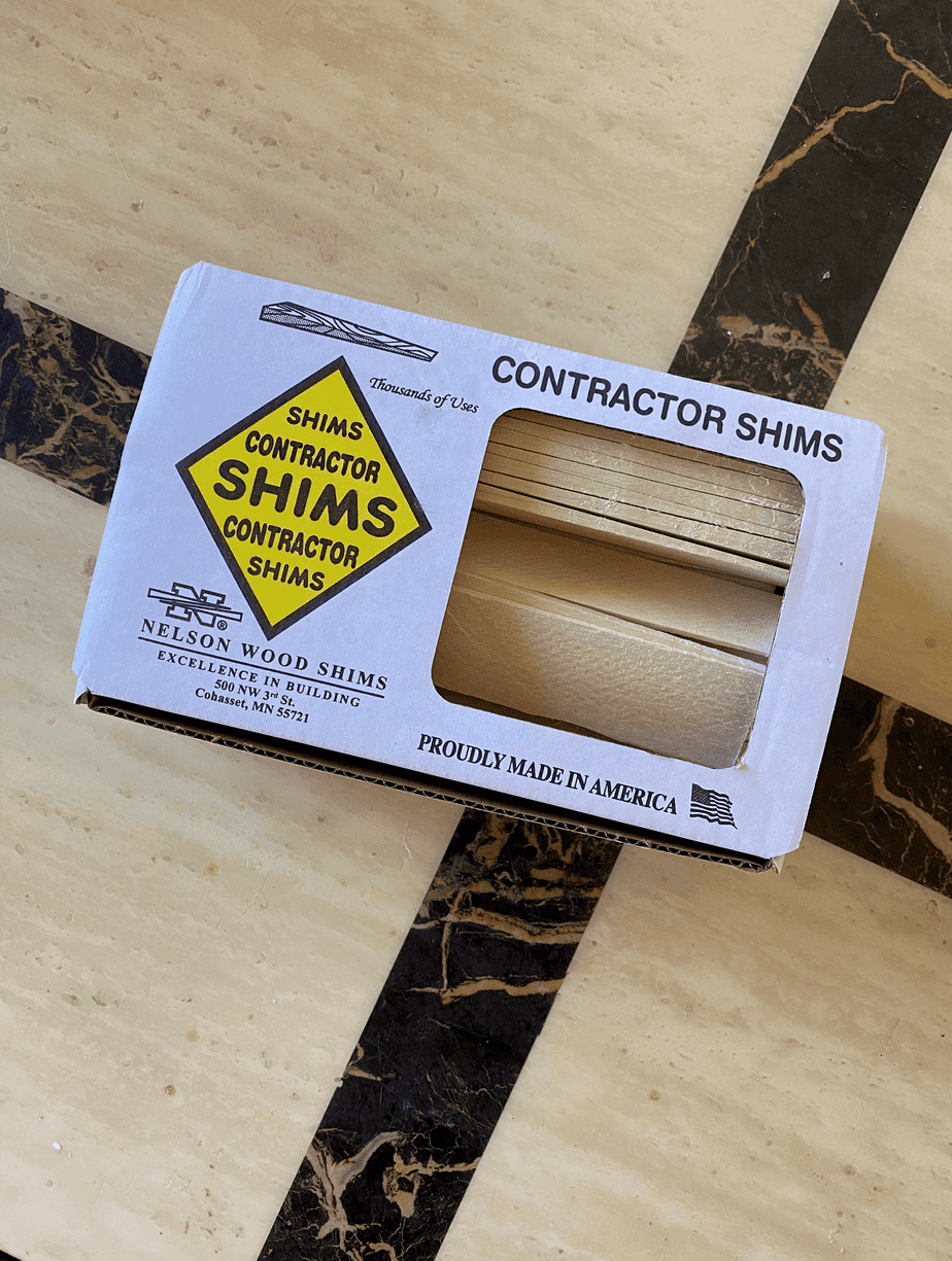 Wooden Nelson contractor shims in a white box.