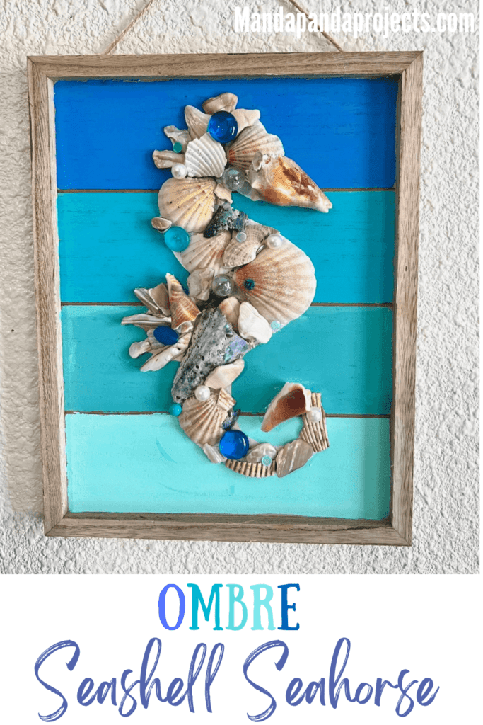 Ombre blue and teal background with a seahorse made out of seashells and pearls and marbles for DIY decor for a summer nautical, coastal, beach house.