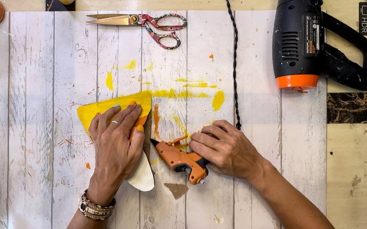 Gluing the candy corn shut with hot glue gun.