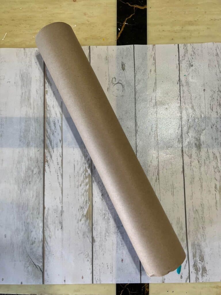 Roll of brown Kraft paper on a table.